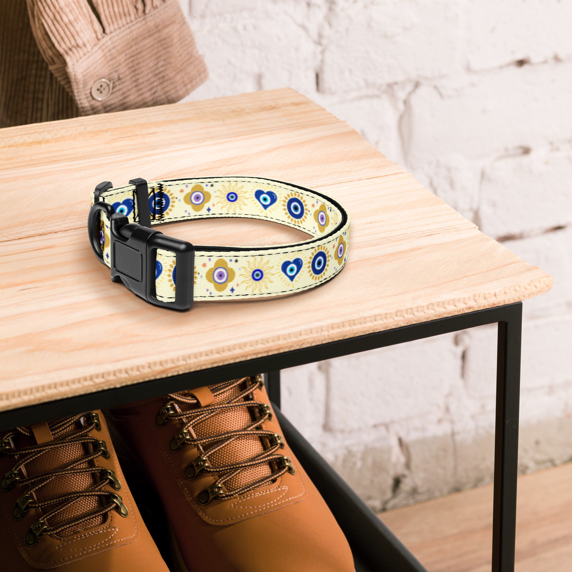 Evil Eye patterned dog collar on top of a wooden shoe rack